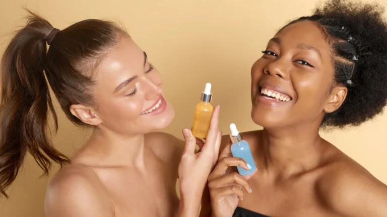 Two women comparing skincare products containing Alpha Hydroxy Acid (AHA), highlighting its benefits for radiant and youthful skin